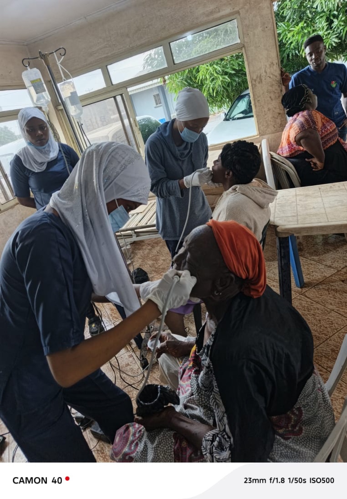 A volunteer performing an eye examination at the Agbowa-Ikosi outreach, 2026