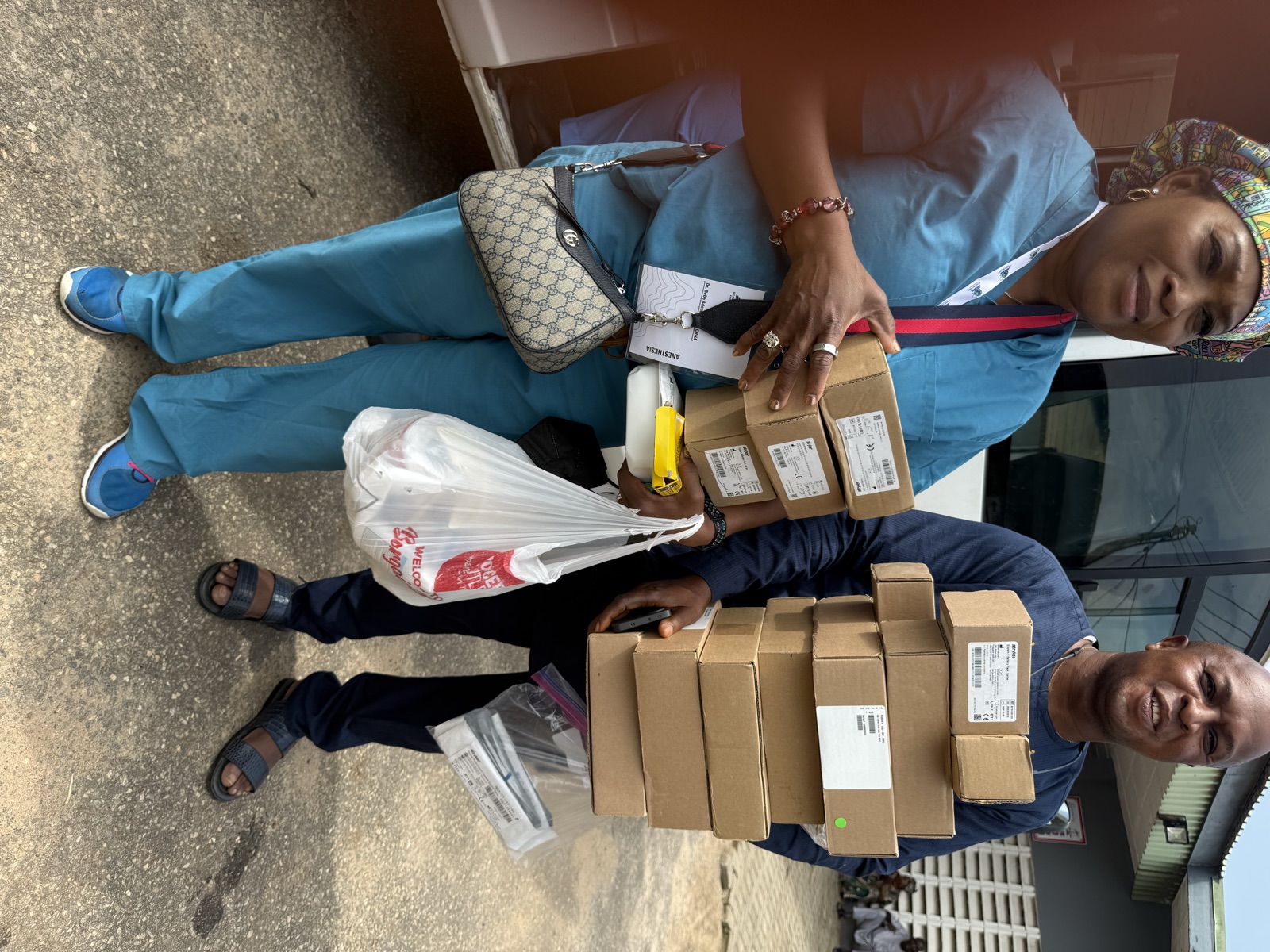 KBB volunteers transporting boxes of donated medical supplies, 2026 mission