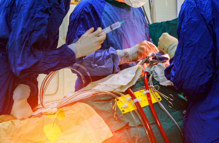 Surgeons performing an operation, representing KBB's trauma surgery program